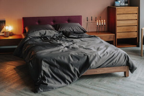 Draped luxury cotton bedding shown on our low upholstered Iona wooden bed