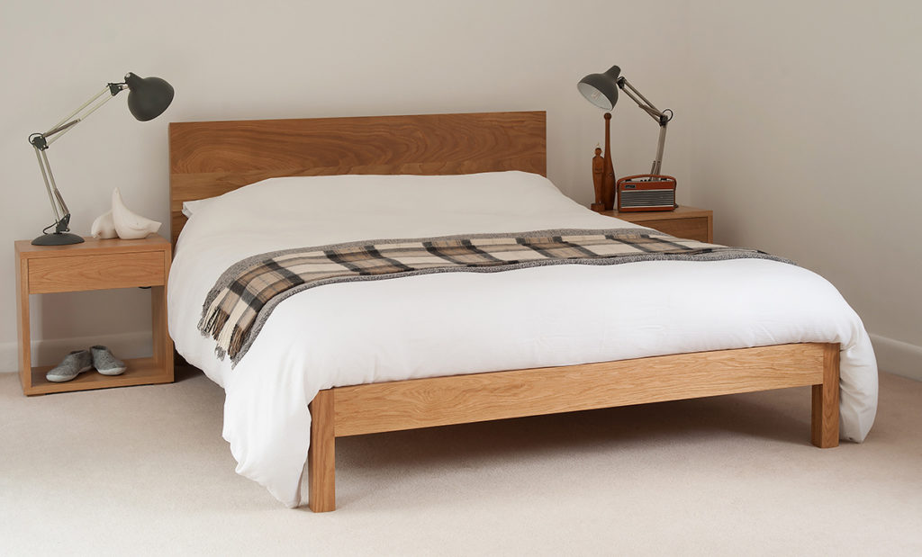 A contemporary solid wood bed the Malabar, designed and made by natural bed company