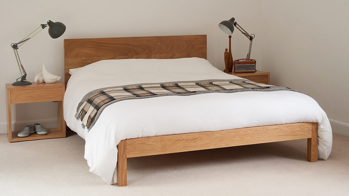 A contemporary solid wood bed the Malabar, designed and made by natural bed company