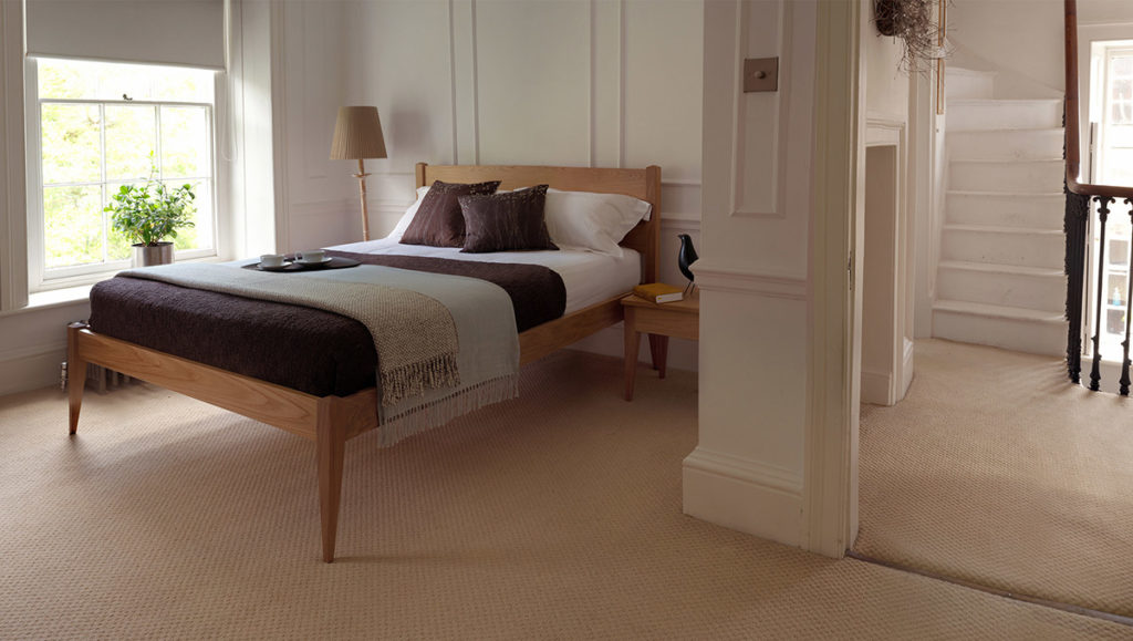 A traditional Georgian bedroom features our Oak Cochin Bed and bedside tables.