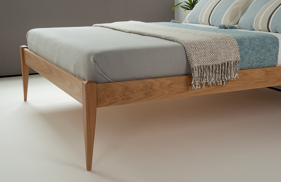 A closer view of the tall tapering legs of our hand-made Cochin wooden bed