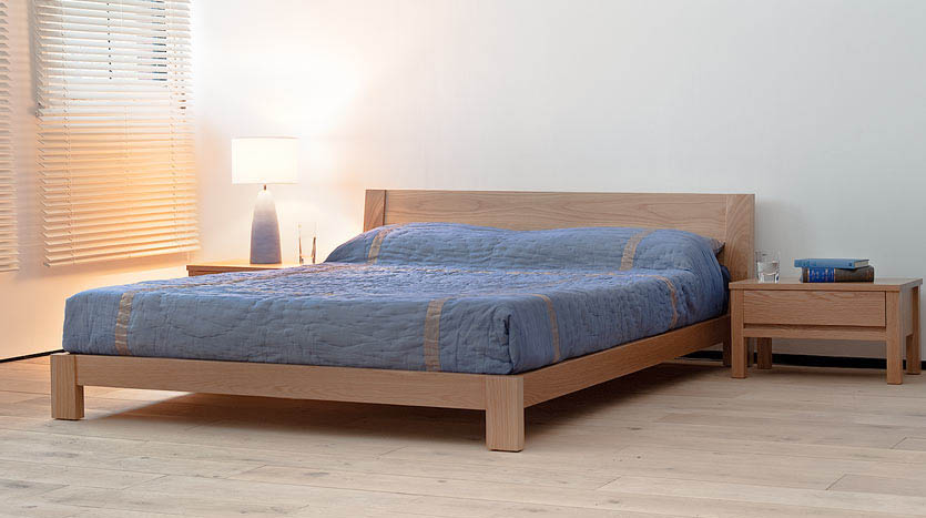 Java a contemporary low wooden bed in solid oak