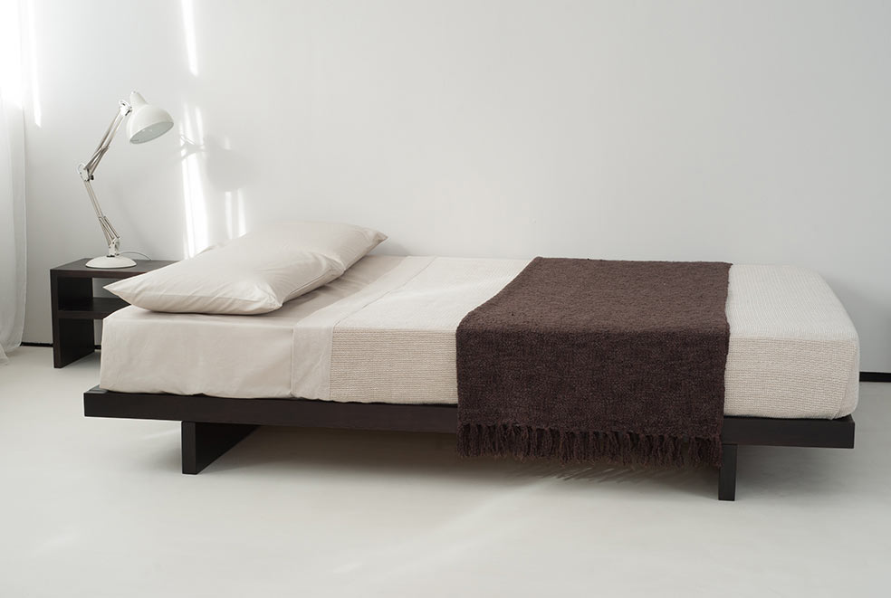 Contemporary low wooden platform bed without optional headboard