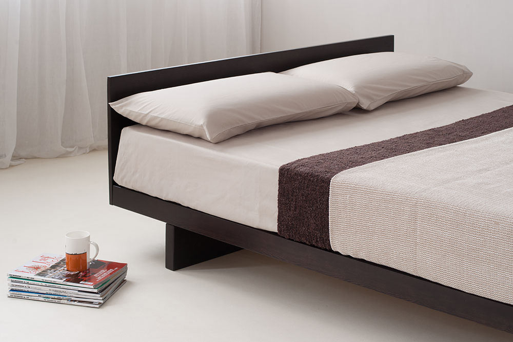 Contemporary low wooden platform bed