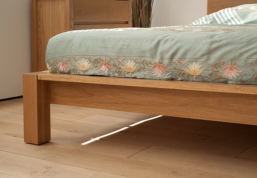 A closer view of the leg and frame of our Ocean Contemporary wooden bed in Oak