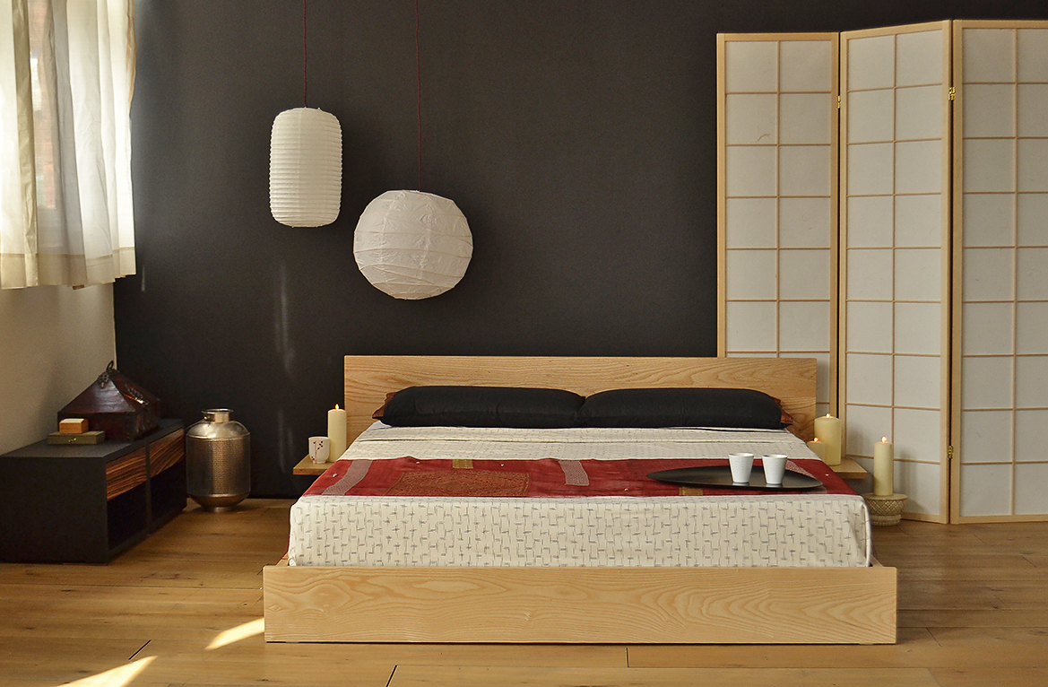 Japanese style bedroom featuring our low solid wood Kulu platform bed. Hand made to order in Britain