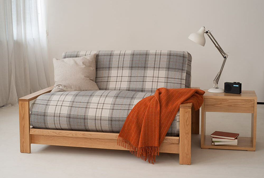 Panama Oak framed futon sofa bed, the futon has a check loose cover in wool