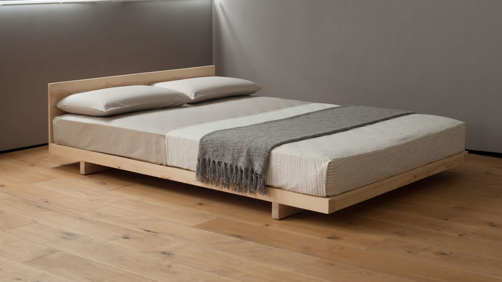 Kobe is an ultra low wooden bed or futon base which comes with or without a headboard