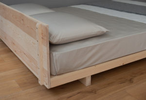 A view of the back of the headboard of our Pine Kobe low wooden bed