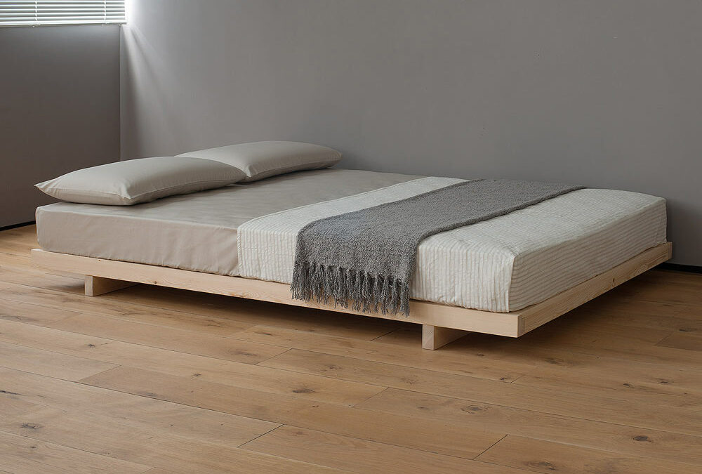 Kobe a low platform style bed here Pine and without the optional headboard