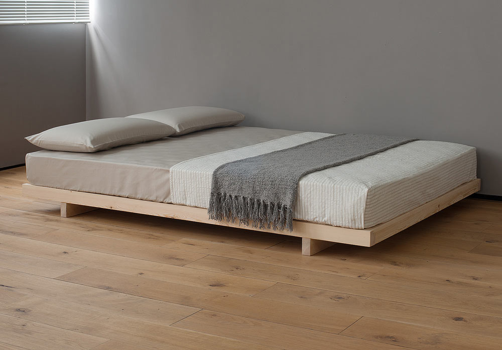 Kobe a low platform style bed here Pine and without the optional headboard