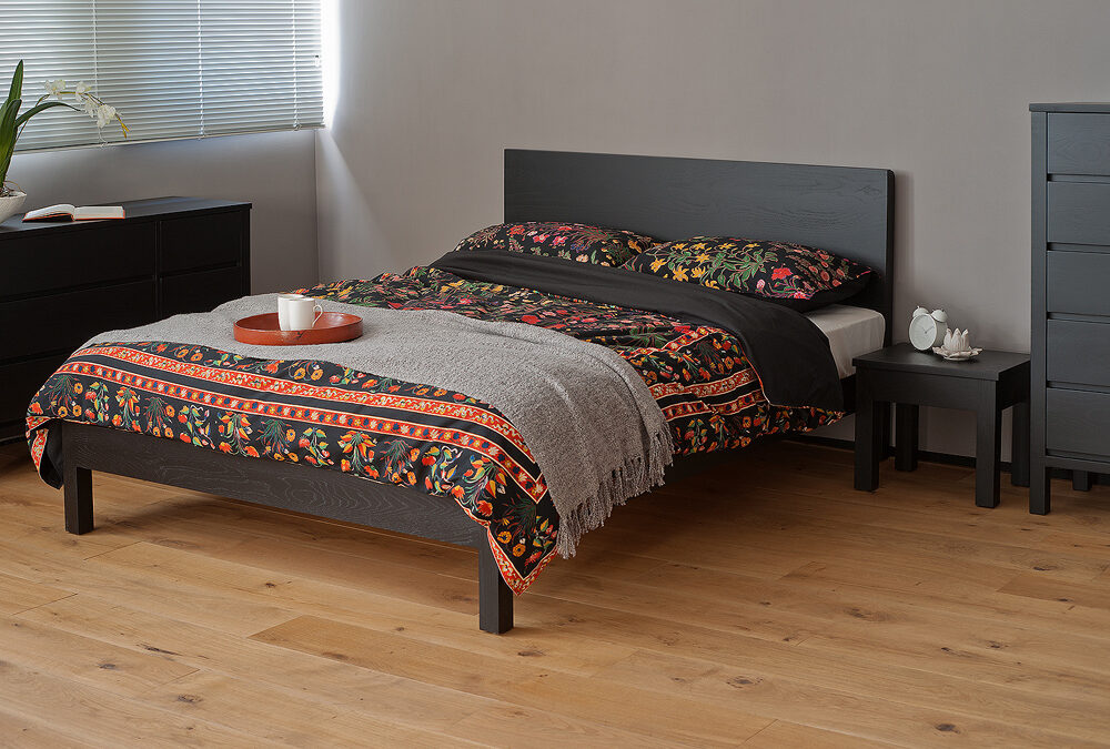 Exotic bedding on our Black Malabar wooden bed