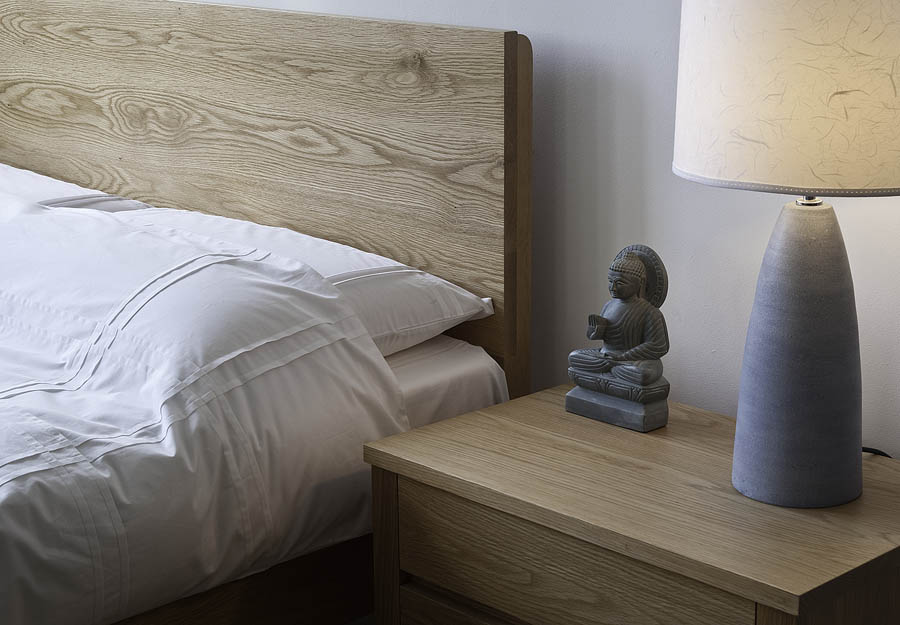 A closer view of the malabar contemporary wooden bed headboard in Oak