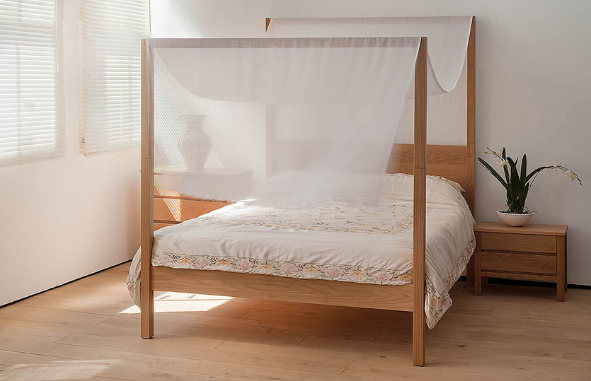 Oasis four poster wooden bed is hand made from solid wood. Shown here with fabric canopy