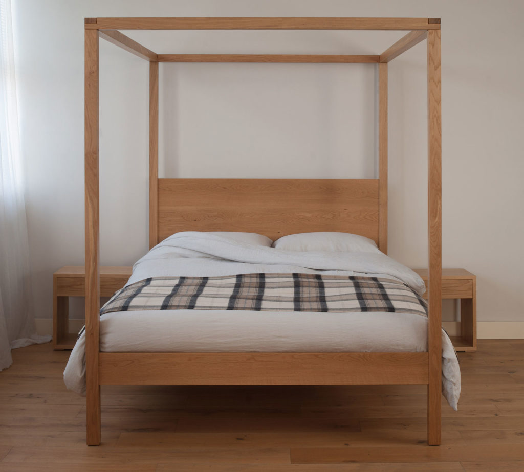 A contemporary uk made four poster bed made from solid wood the Orchid here is in oak