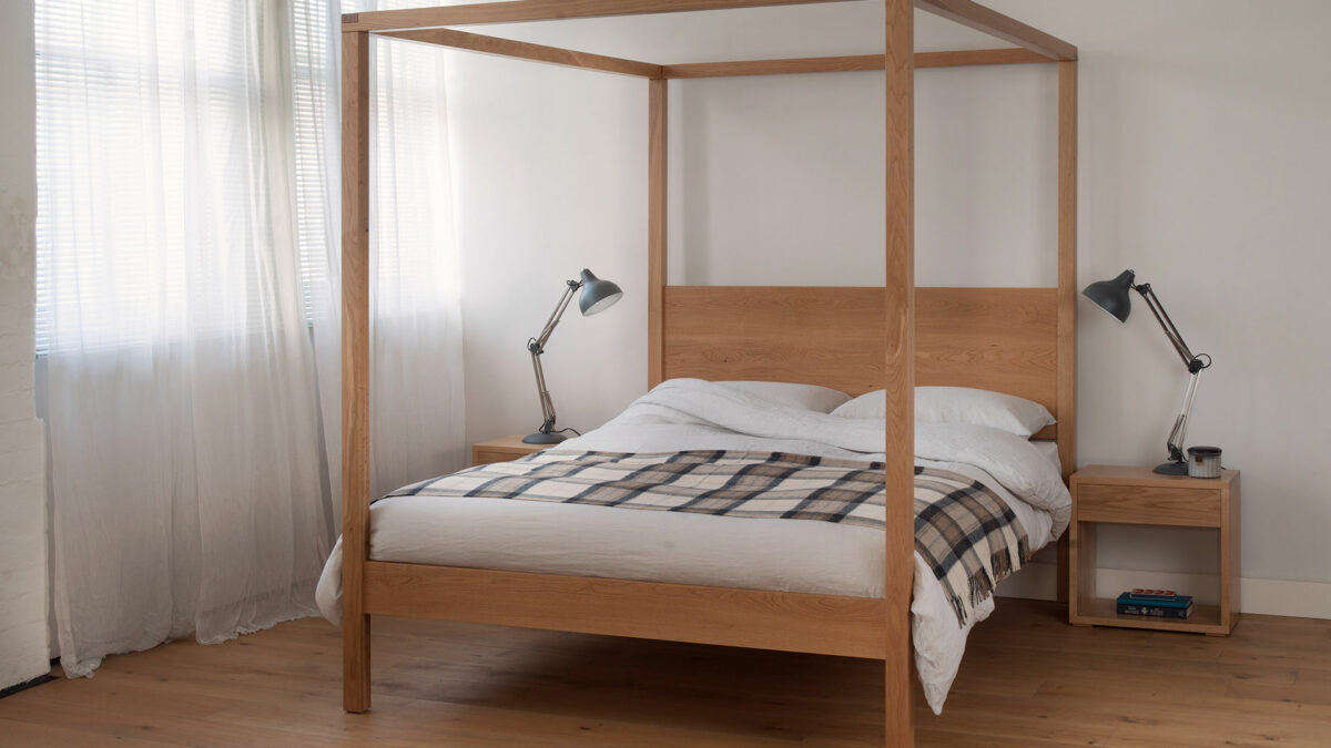 Orchid wooden four poster bed in oak shown with matching Oak Cube bedside tables