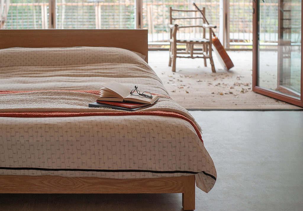 Sonora a contemporary low wooden bed in solid oak