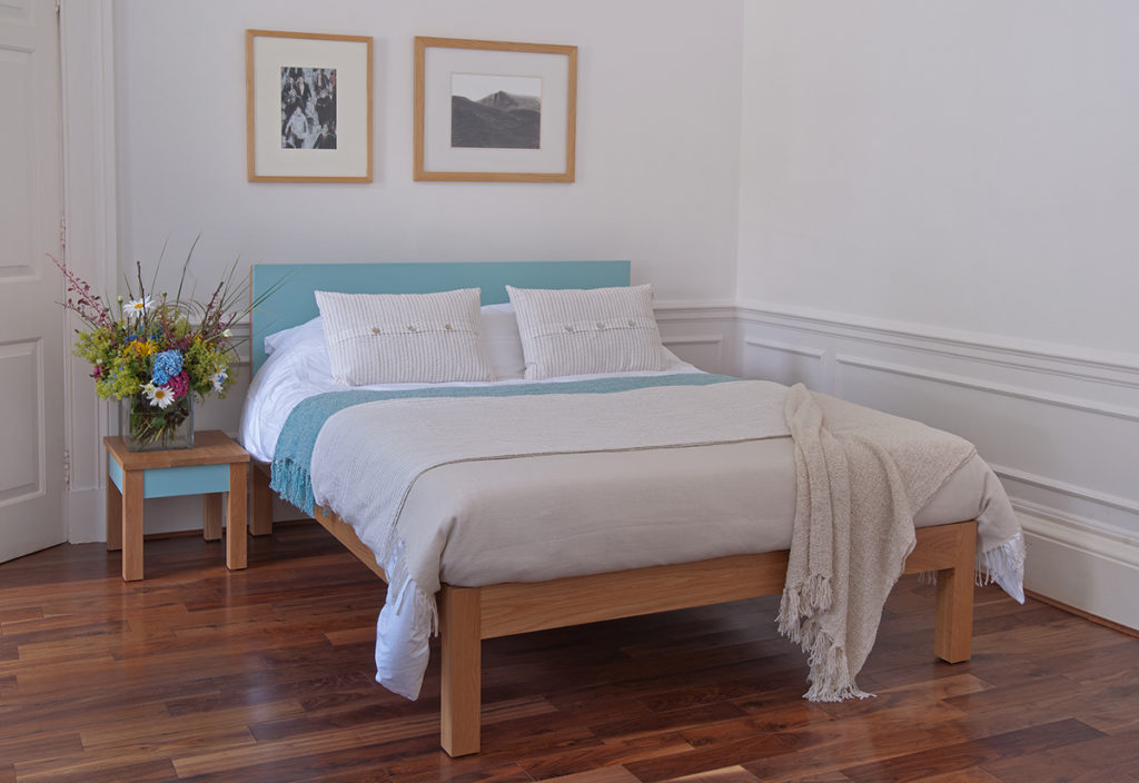 Blue bedroom scheme using the Tao solid wooden Bed in Oak and Pale Blue