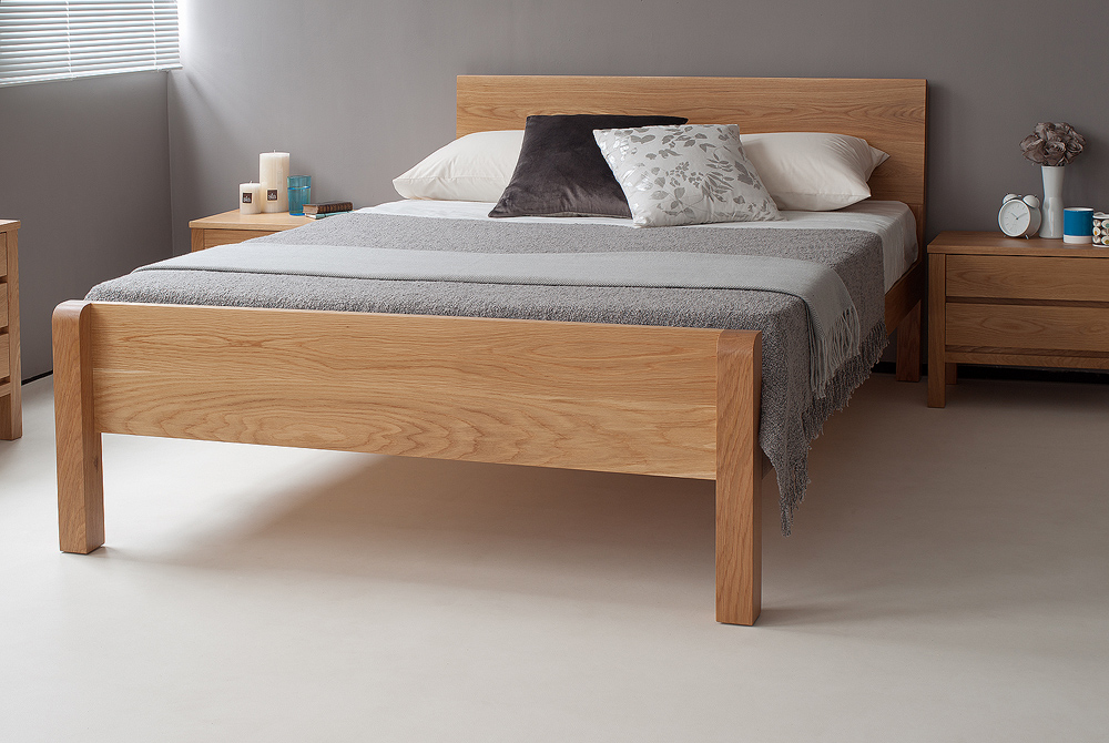 Tibet a chunky modern solid wooden bed shown here in Oak