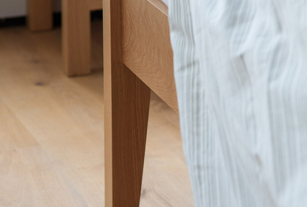 A close up of the leg joint of our Zanskar solid wooden bed