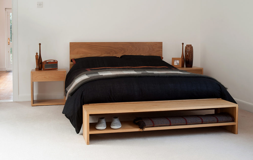 Scandinavian look solid oak modern malabar bed shown with Cube bedside table & oak storage bench