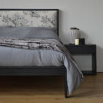 Charcoal linen bedding and cosy blanket on black oak Shetland bed