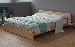 Kulu is a low Japanese style bed made in the uk from solid wood, in this case Ash