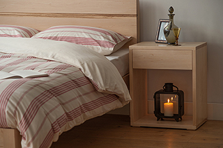 Maple Tibet Bed with matching Maple tall Cube bedside table. All made by us in UK.