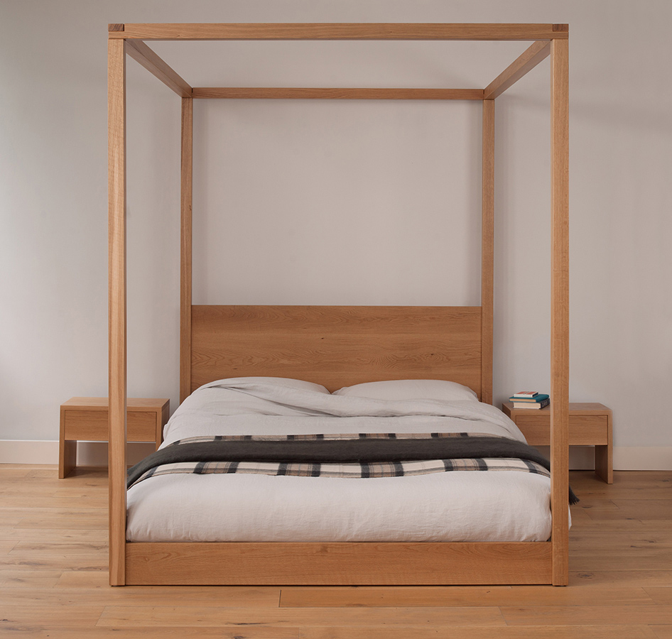 Cube - a low elegant and modern four poster bed. Hand made in Britain from solid wood.