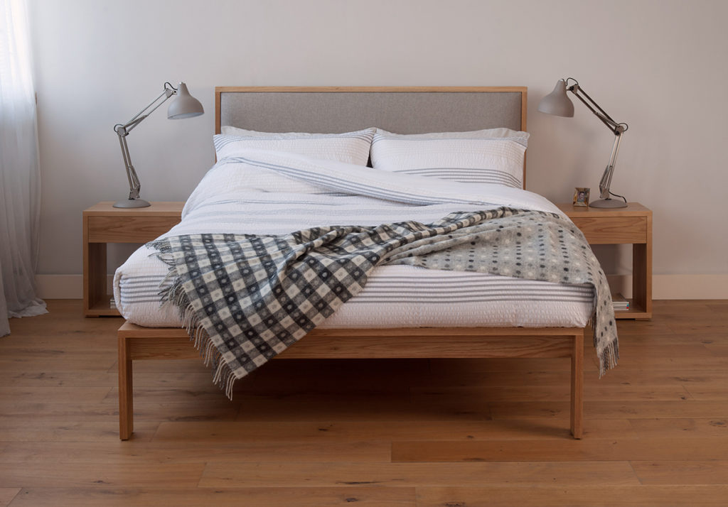 Contemporary bedroom with Shetland, a wooden bed with padded headboard