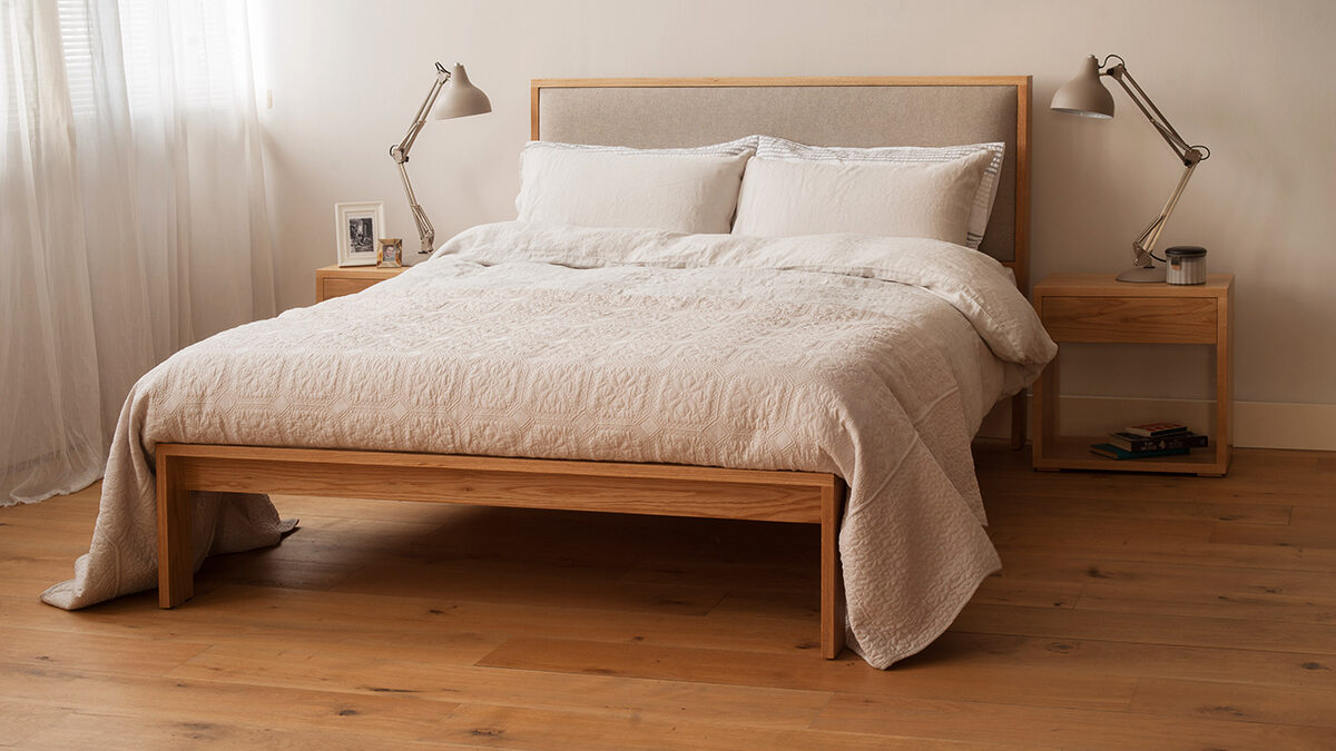 Shetland wooden bed frame with padded headboard in neutral colours bedroom