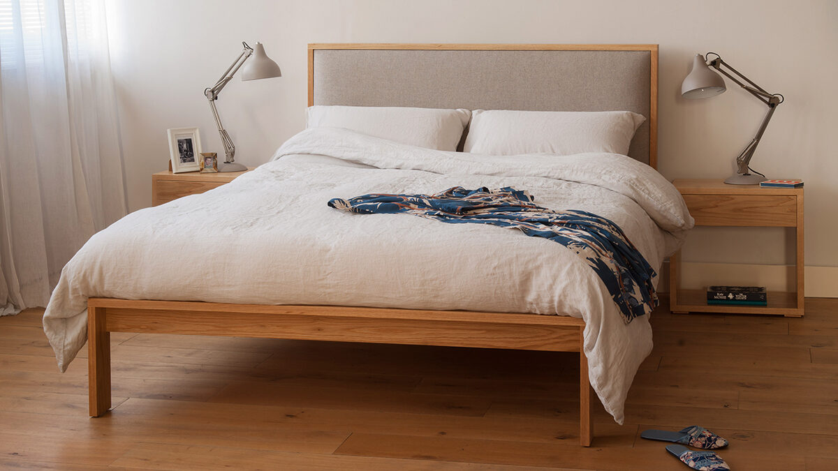 Shetland contemporary wooden bed with padded headboard, here in Oak with oak bedside tables