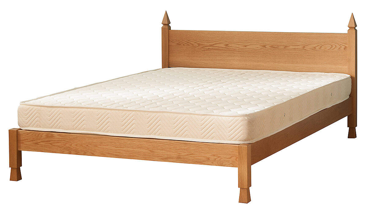 Mandalay Indian style bed shown without bedding and in Oak wood