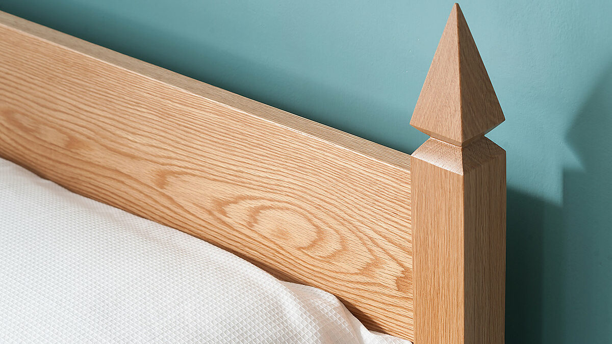 A close up of the Mandalay bed headboard post made from solid Oak