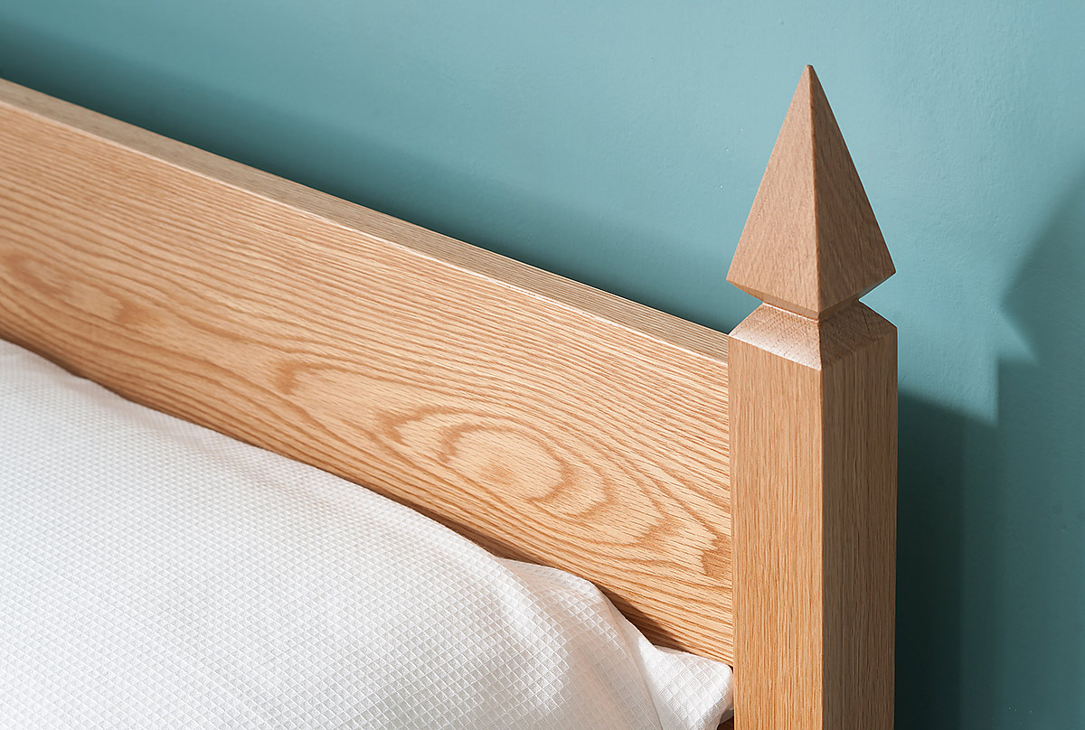 A close up of the Mandalay bed headboard post made from solid Oak