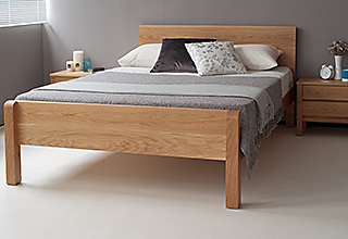 oak Tibet, a solid wooden bed shown here with a footboard available on request