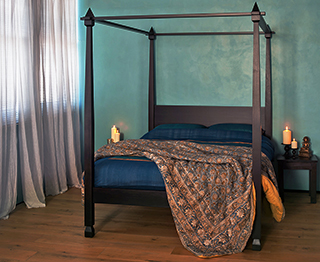 Indian inspired bedroom featuring our Raj carved 4 poster bed