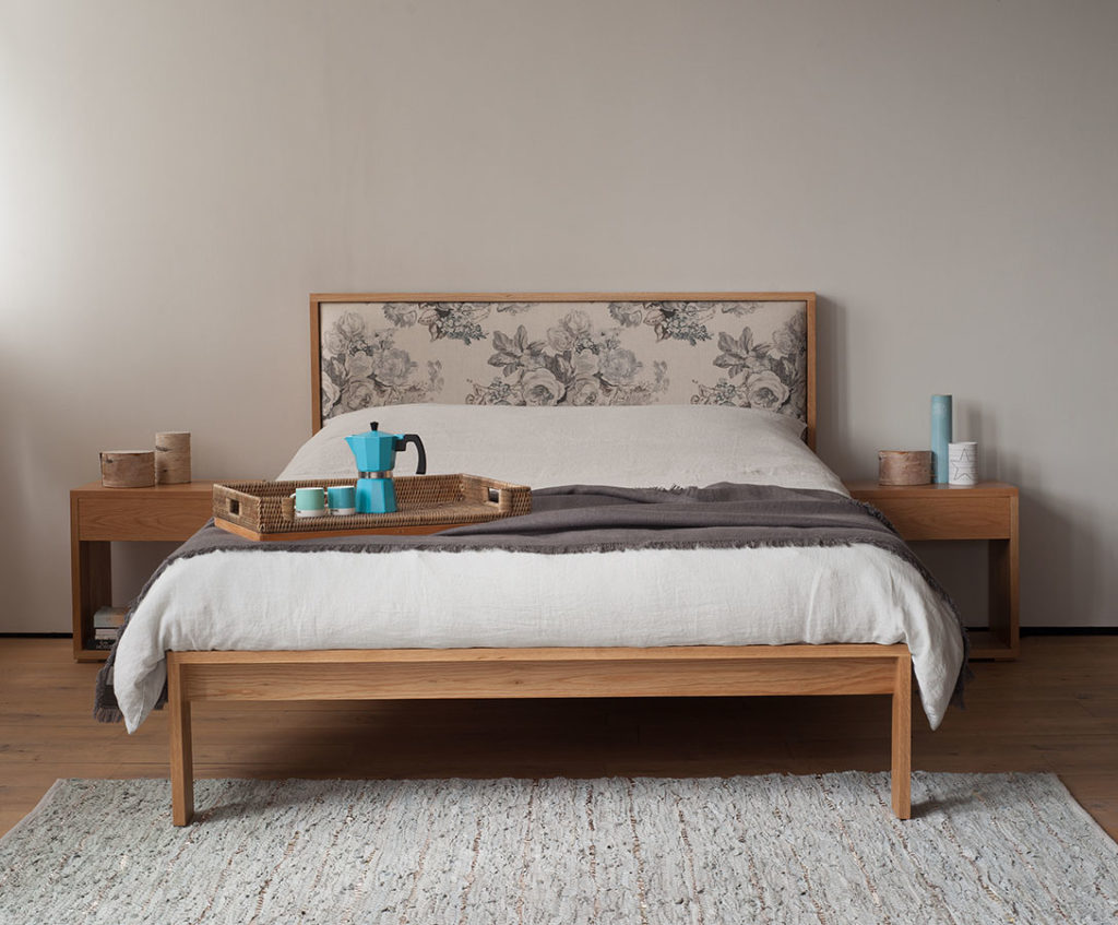 Shetland classic wooden bed with upholstered headboard shown with matching oak bedside tables