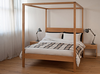 Contemporary classic Orchid four poster wooden bed here shown in oak