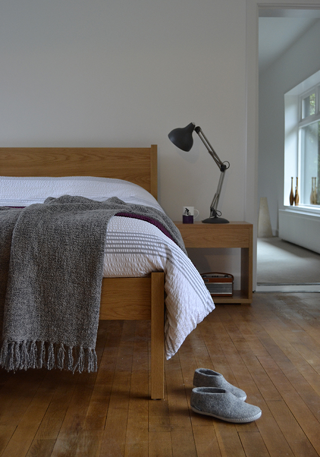 Felted wool slipper shoes with Classic Zanskar bed and Cube bedside table.