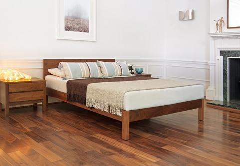 Scandinavian chic bedroom with solid walnut low wooden Sahara bed