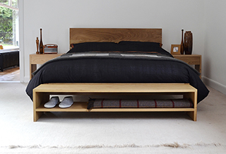 Calm contemporary bedroom with an Oak Kingsize Malabar bed and Oak storage bench