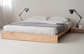 luxury linen bedding for a soft minimal look here on our low wooden Ki bed