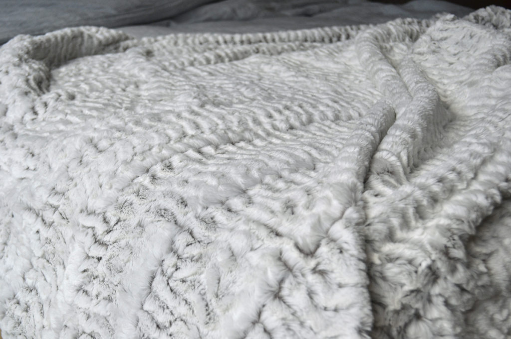 white faux fur throw