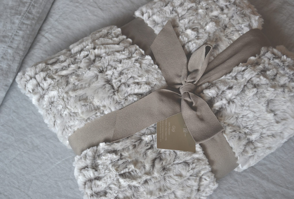 white faux fur throw