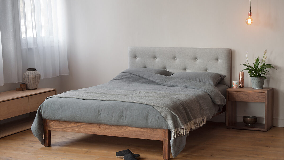 buttoned headboard bed with linen bedding