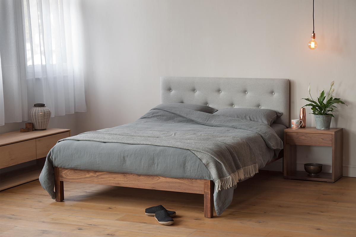 buttoned headboard bed with linen bedding