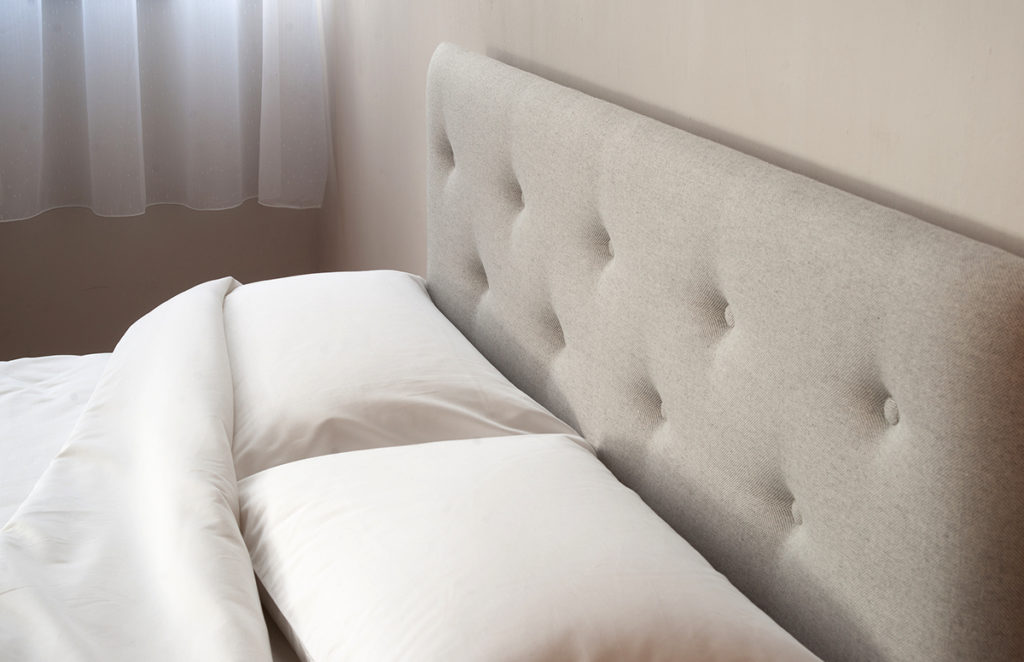 buttoned headboard bed