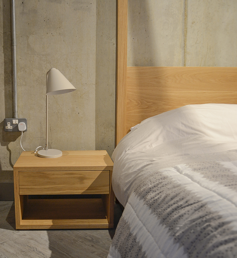 Cube a contemporary solid wood 4 poster bed with cube 1 drawer bedside table.