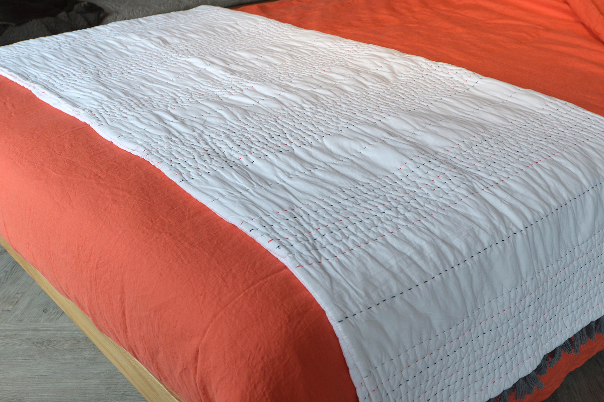 lisbon coral linen and chain stitched quilt